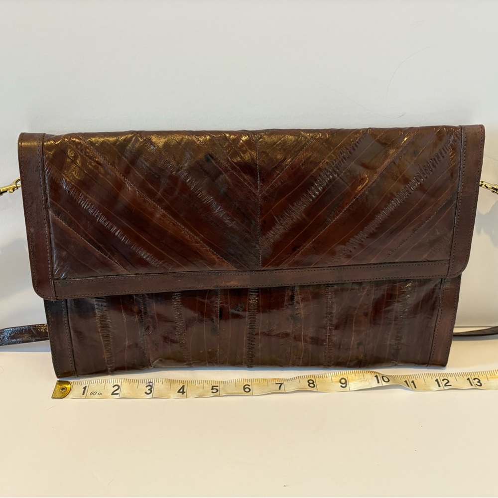 Real eel skin clutch purse. Never used. Excellent condition from no smoking home